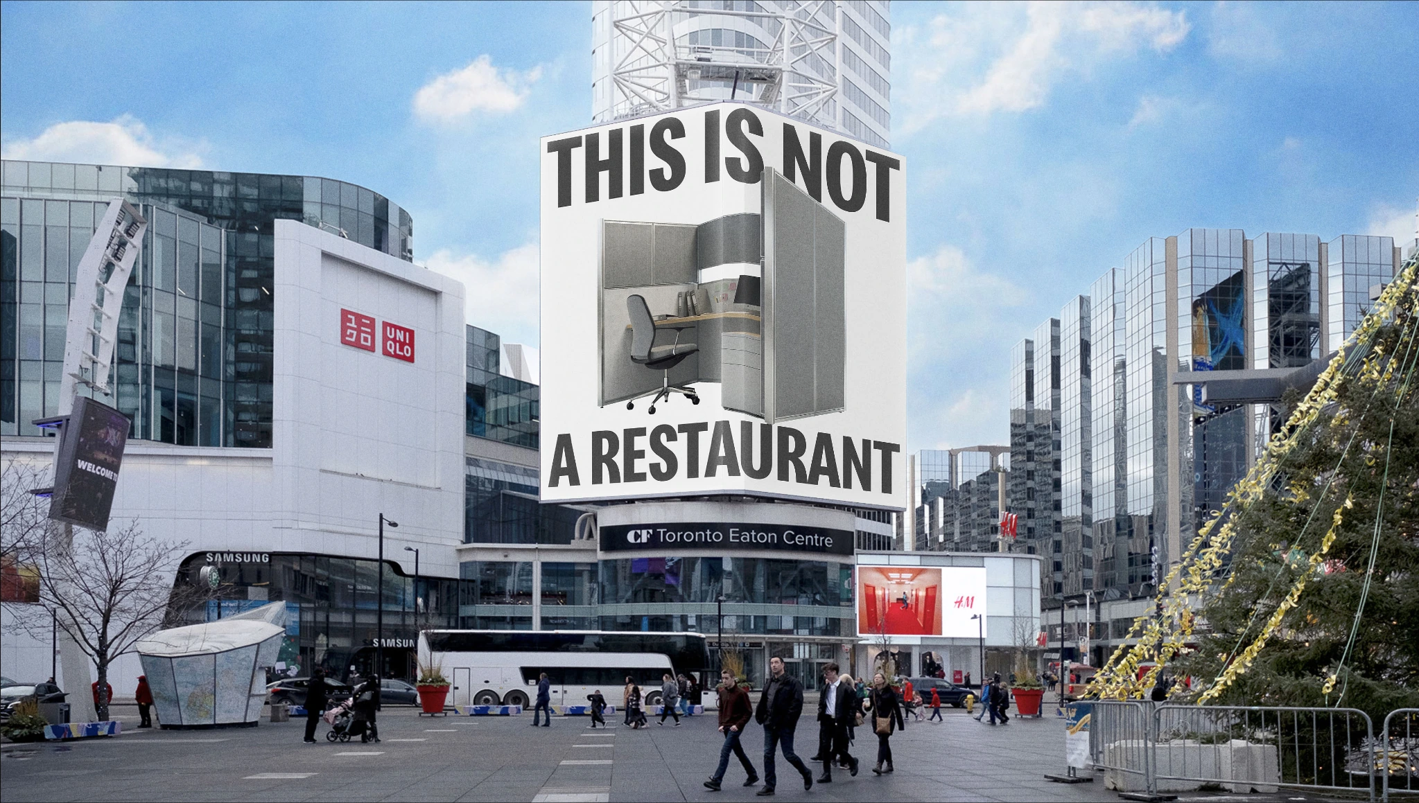 Gran pantalla exterior de McDonald's Canada con la frase This is not a restaurant y una oficina mostrada en el centro de Toronto.
