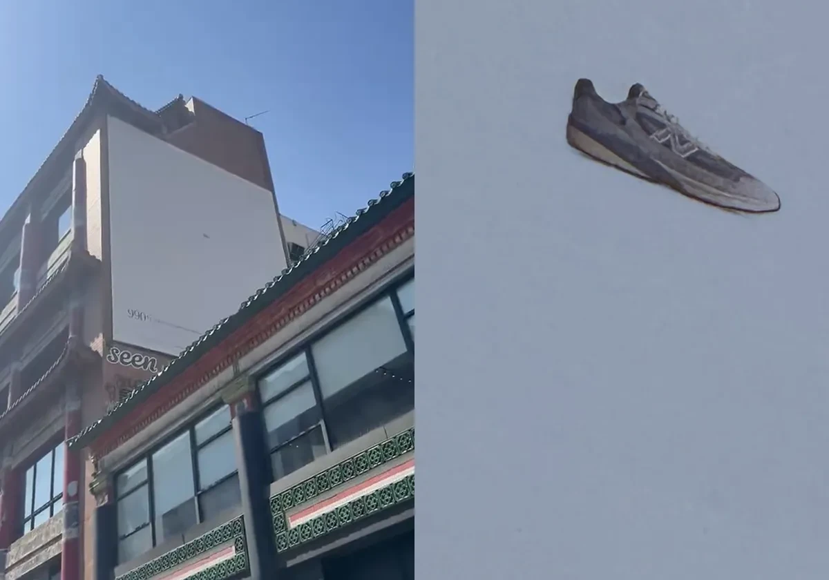 Espectacular minimalista del New Balance 990v7 en Nueva York con un sneaker gris diminuto sobre un enorme fondo casi vacío.